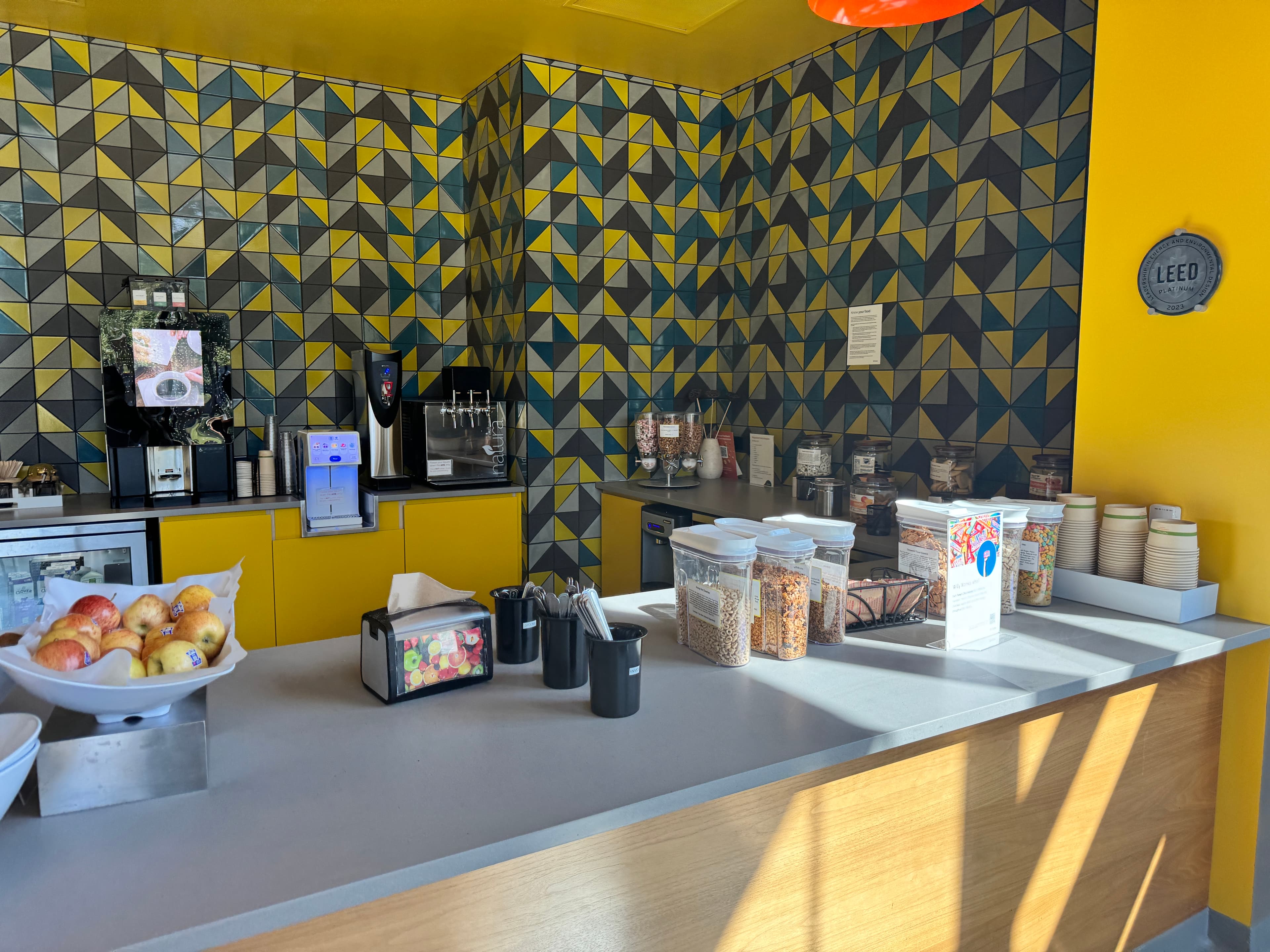 Kitchen counter with fruit, cereals, coffee machine
